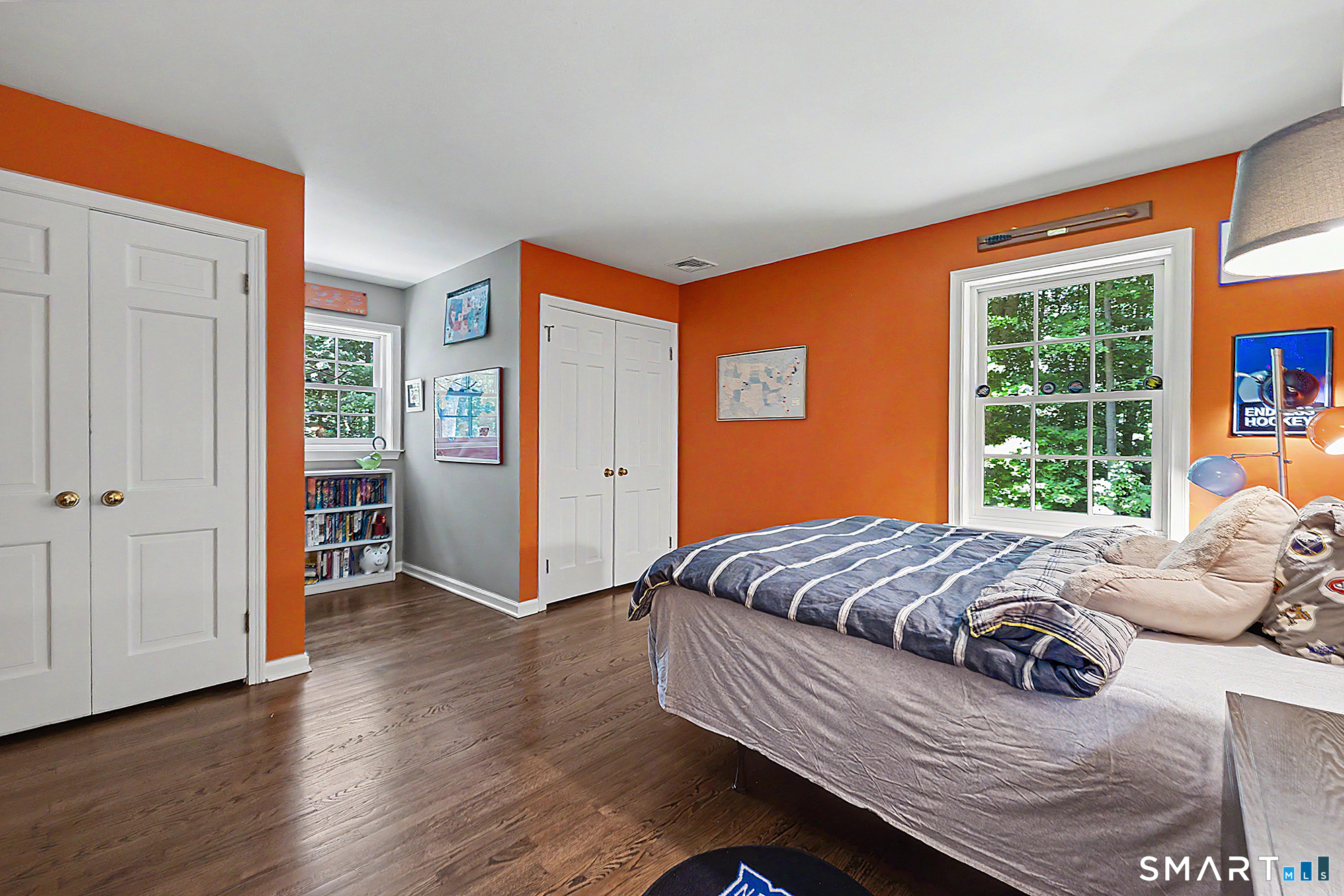 33 Hunter Lane Ridgefield, CT 06877 - Photo 27 of 39 a bedroom with a bed and wooden floor