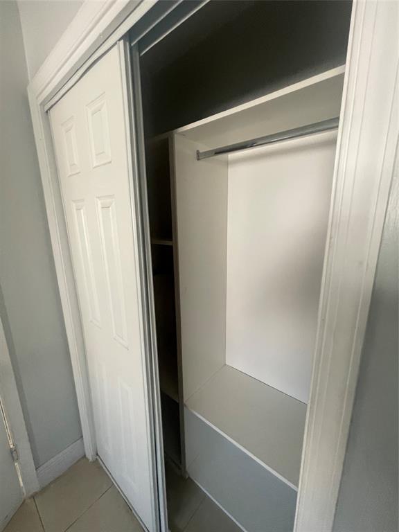 363 Southwest 15th Street, Unit 4 Pompano Beach, FL 33060 - Photo 14 of 16 a bathroom with a glass shower door