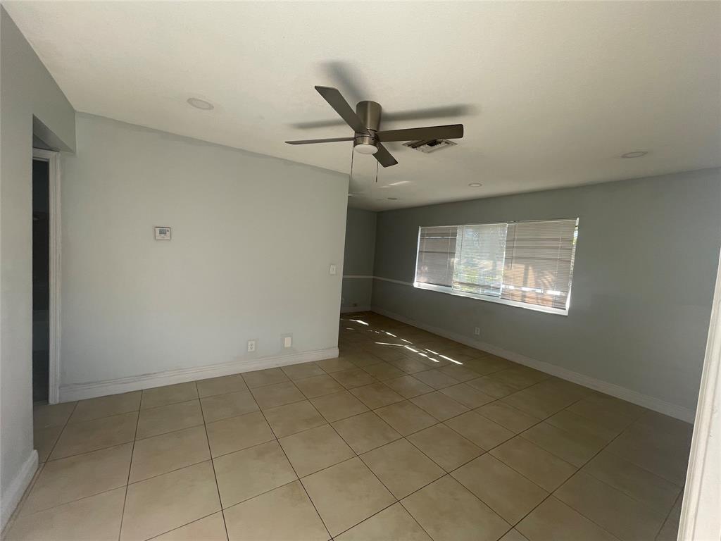 363 Southwest 15th Street, Unit 4 Pompano Beach, FL 33060 - Photo 16 of 16 a view of an empty room with a window