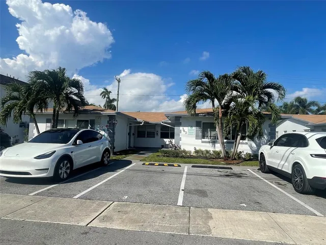 a view of a car parked in front of a house