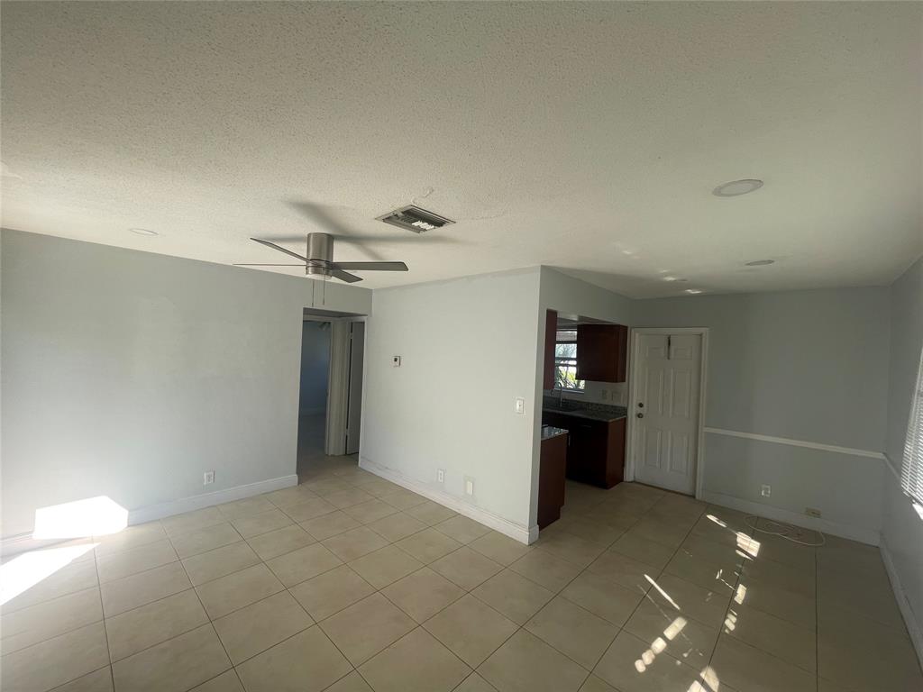 363 Southwest 15th Street, Unit 4 Pompano Beach, FL 33060 - Photo 10 of 16 a view of a livingroom and hallway