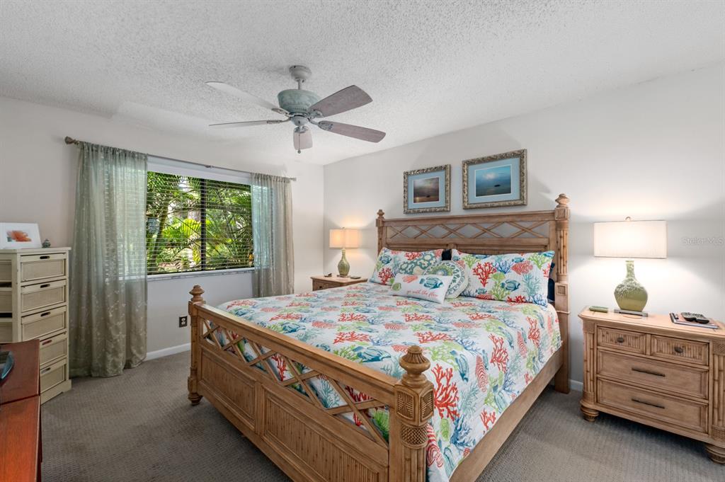 1701 Pelican Cove Road, Unit 359 Sarasota, FL 34231 - Photo 17 of 37 a bedroom with a bed and a window