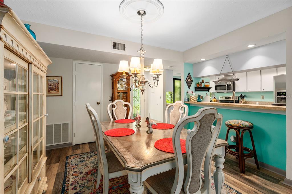 1701 Pelican Cove Road, Unit 359 Sarasota, FL 34231 - Photo 9 of 37 a view of a dining room with furniture
