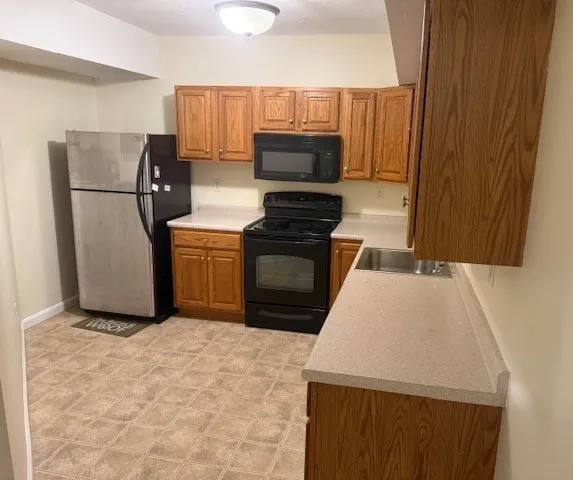 a kitchen with appliances and cabinets