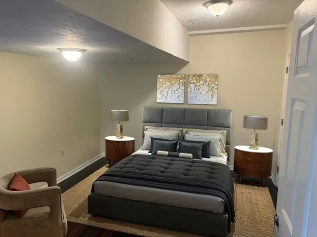 a bedroom with a bed and window