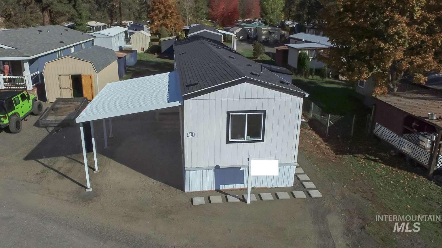 10 Kamloop Lane Orofino, ID 83544 - Photo 13 of 17 Single-story residence featuring light-colored siding and a dark-shingled roof