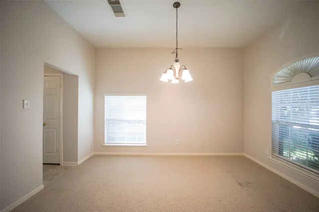 a view of empty room with windows