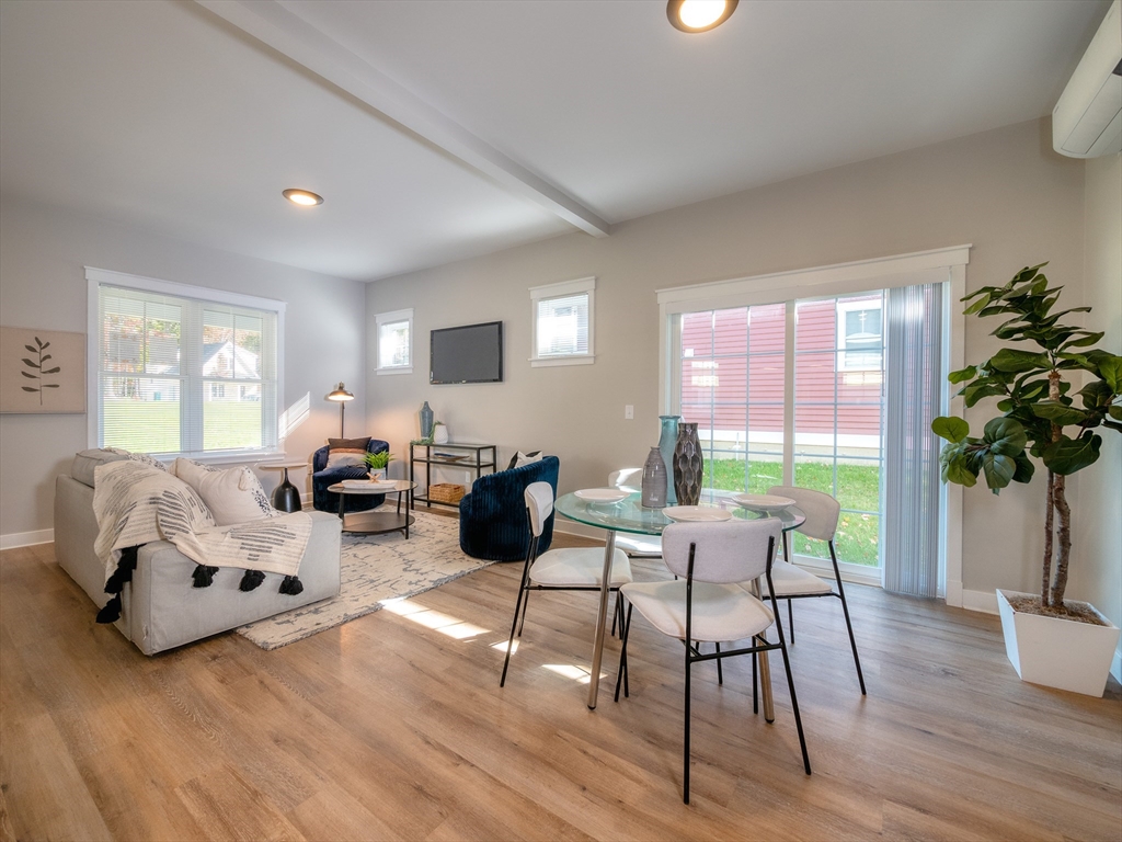 30 Cottage Lane Lancaster, MA 01523 - Photo 5 of 16 a living room with furniture hard wood floor and a floor to ceiling window