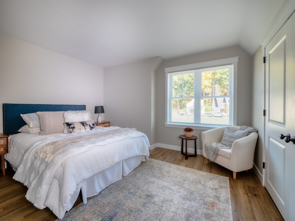 30 Cottage Lane Lancaster, MA 01523 - Photo 10 of 16 a bedroom with bed and a couch