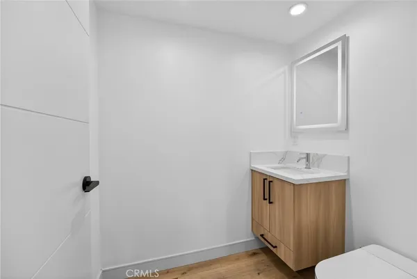 a bathroom with a sink toilet and vanity