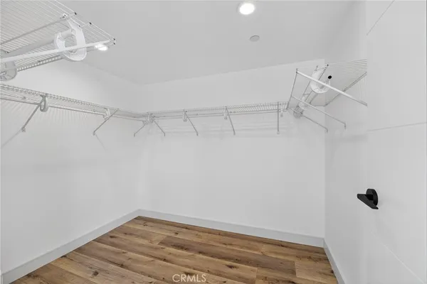 a bathroom with a granite countertop sink a mirror and shower