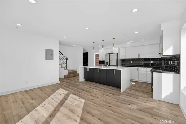 a view of kitchen with wooden floor