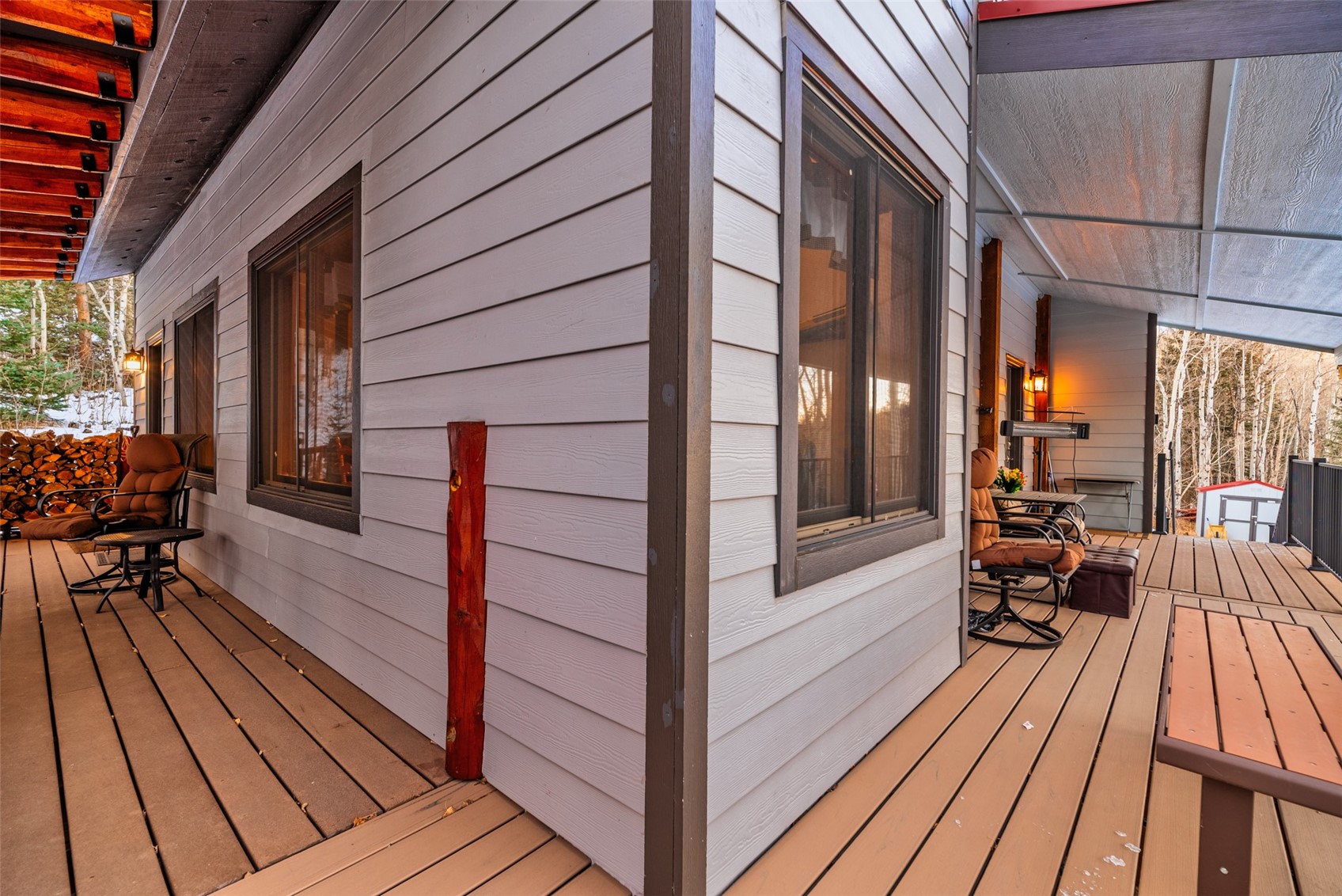 2150 Michigan Hill Road Jefferson, CO 80456 - Photo 42 of 50 a view of a balcony with chairs and wooden floor