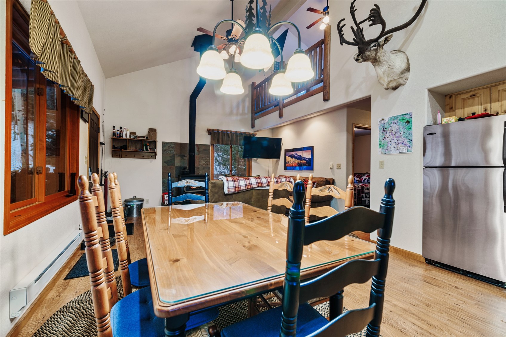 2150 Michigan Hill Road Jefferson, CO 80456 - Photo 8 of 50 a view of a dining room with furniture and wooden floor