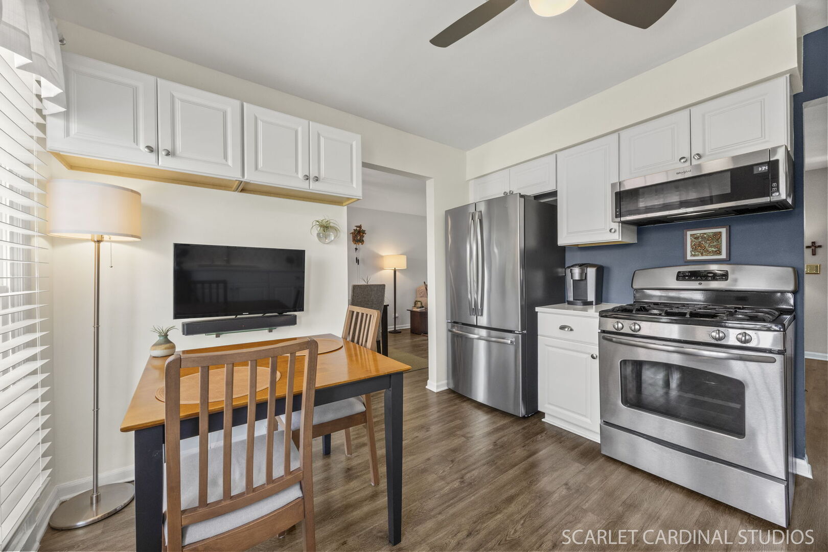 1677 Casa Solana Drive Wheaton, IL 60189 - Photo 11 of 30 a kitchen with stainless steel appliances a stove microwave and a refrigerator