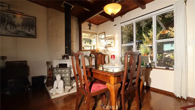 a bathroom with a sink and mirror with toilet