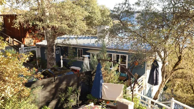 a view of a chairs and table in the patio