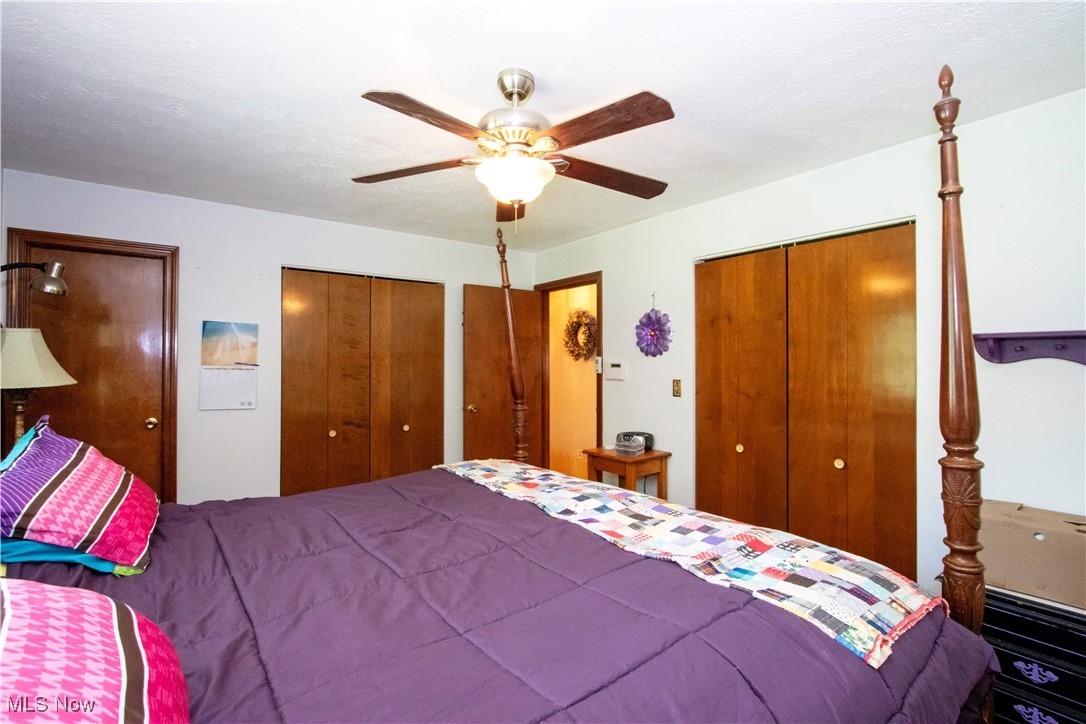 1292 Cinder Road Southeast Carrollton, OH 44615 - Photo 32 of 42 Bedroom featuring multiple closets and ceiling fan