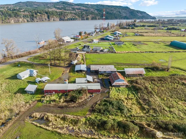an aerial view of a house with garden space and outdoor seating