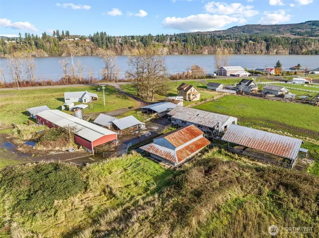 an aerial view of a house with garden space and street view