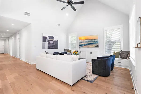 a living room with furniture and windows