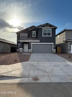 a front view of a house with a garage