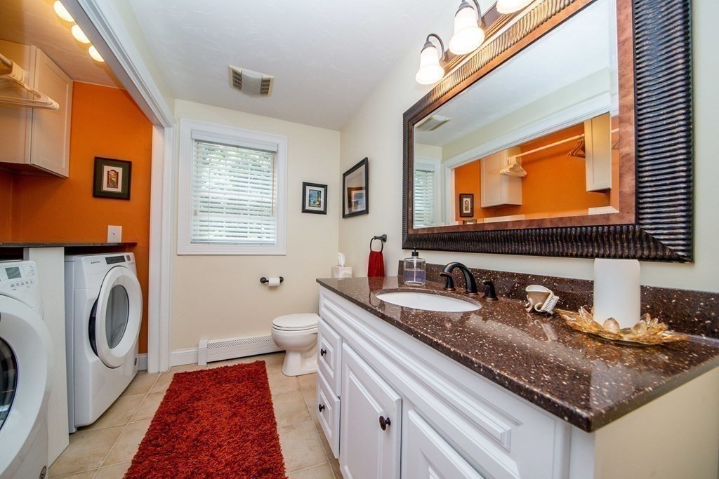 25 Squirrel Island Road Wareham, MA 02576 - Photo 21 of 39 a bathroom with a granite countertop sink and a mirror
