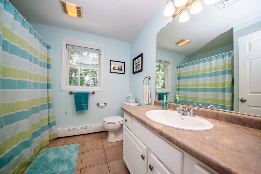 25 Squirrel Island Road Wareham, MA 02576 - Photo 28 of 39 a bathroom with a granite countertop sink and a mirror