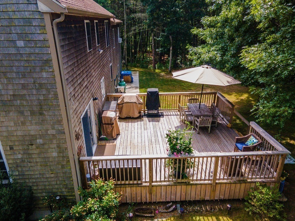 25 Squirrel Island Road Wareham, MA 02576 - Photo 3 of 39 a view of a patio with a table and chairs