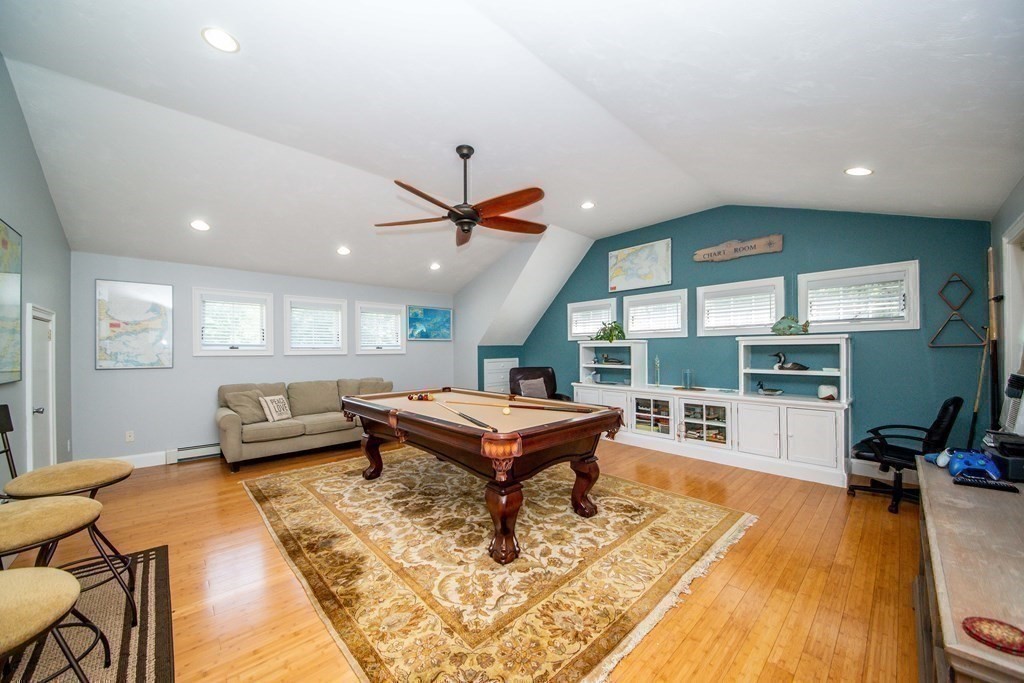 25 Squirrel Island Road Wareham, MA 02576 - Photo 31 of 39 a living room with furniture a wooden floor and a large window