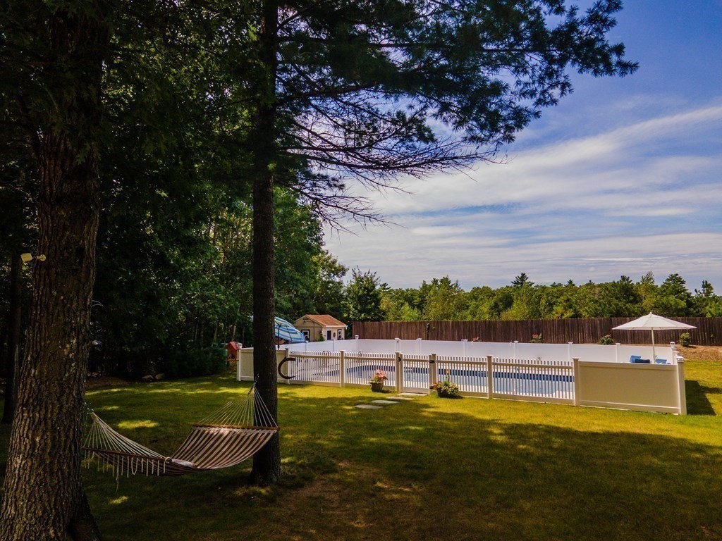 25 Squirrel Island Road Wareham, MA 02576 - Photo 5 of 39 a view of a swimming pool with a garden