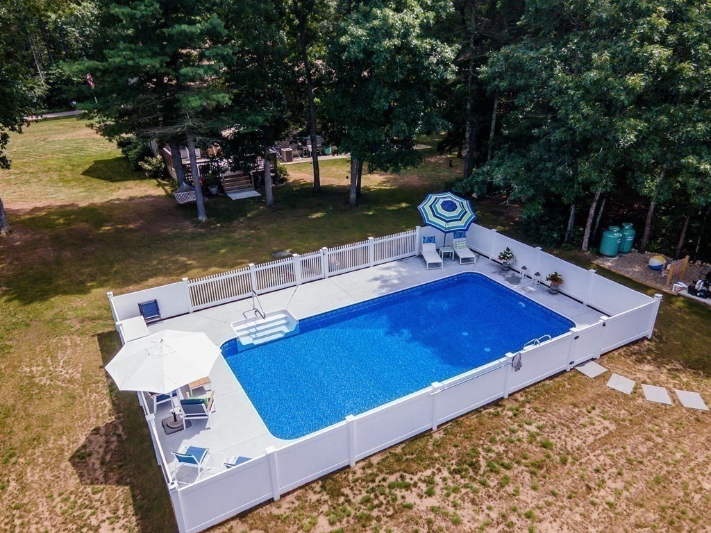 25 Squirrel Island Road Wareham, MA 02576 - Photo 6 of 39 a view of a swimming pool with a lake view