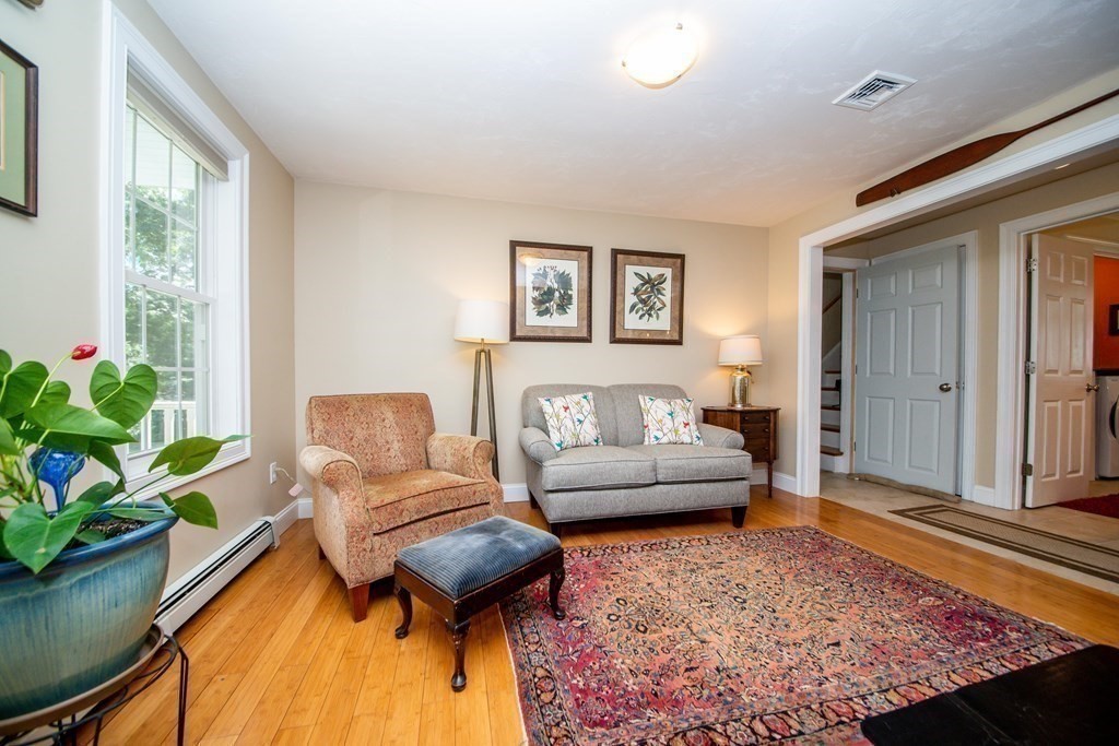 25 Squirrel Island Road Wareham, MA 02576 - Photo 8 of 39 a living room with furniture and a potted plant