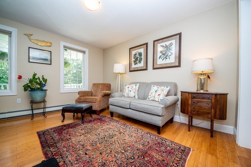 25 Squirrel Island Road Wareham, MA 02576 - Photo 9 of 39 a living room with furniture a lamp a rug and a window