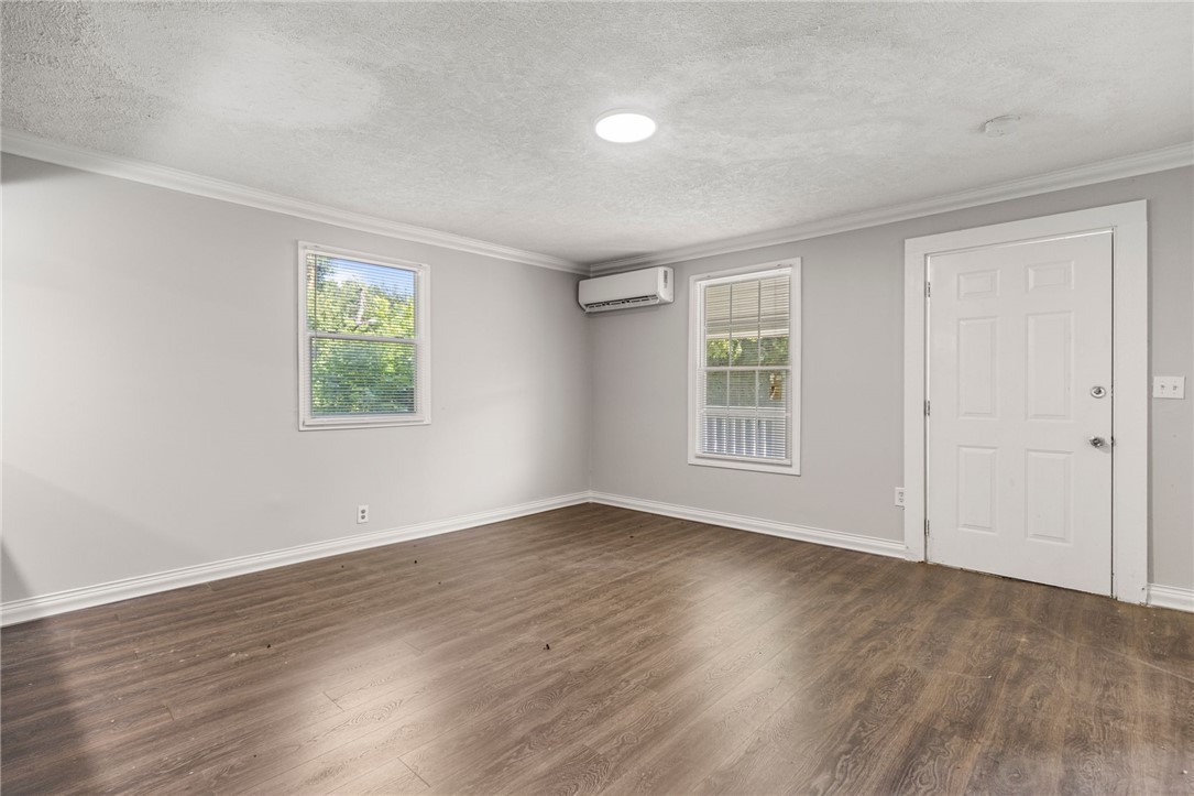 109 Farmer Street Anderson, SC 29621 - Photo 17 of 31 Hardwood-style flooring and natural light create a welcoming and adaptable interior.
