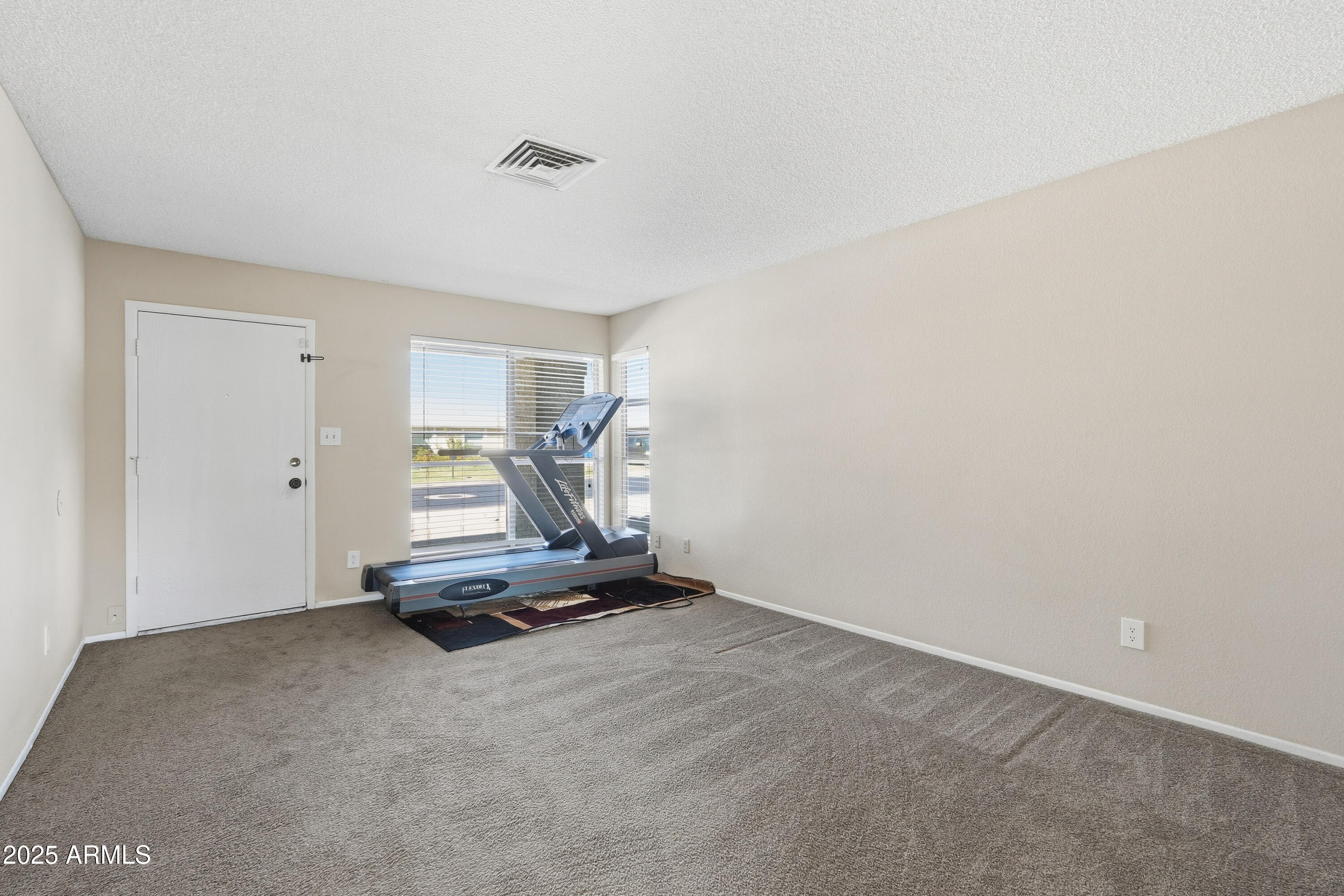 953 East Hackamore Street Mesa, AZ 85203 - Photo 18 of 44 a view of a room with gym equipment
