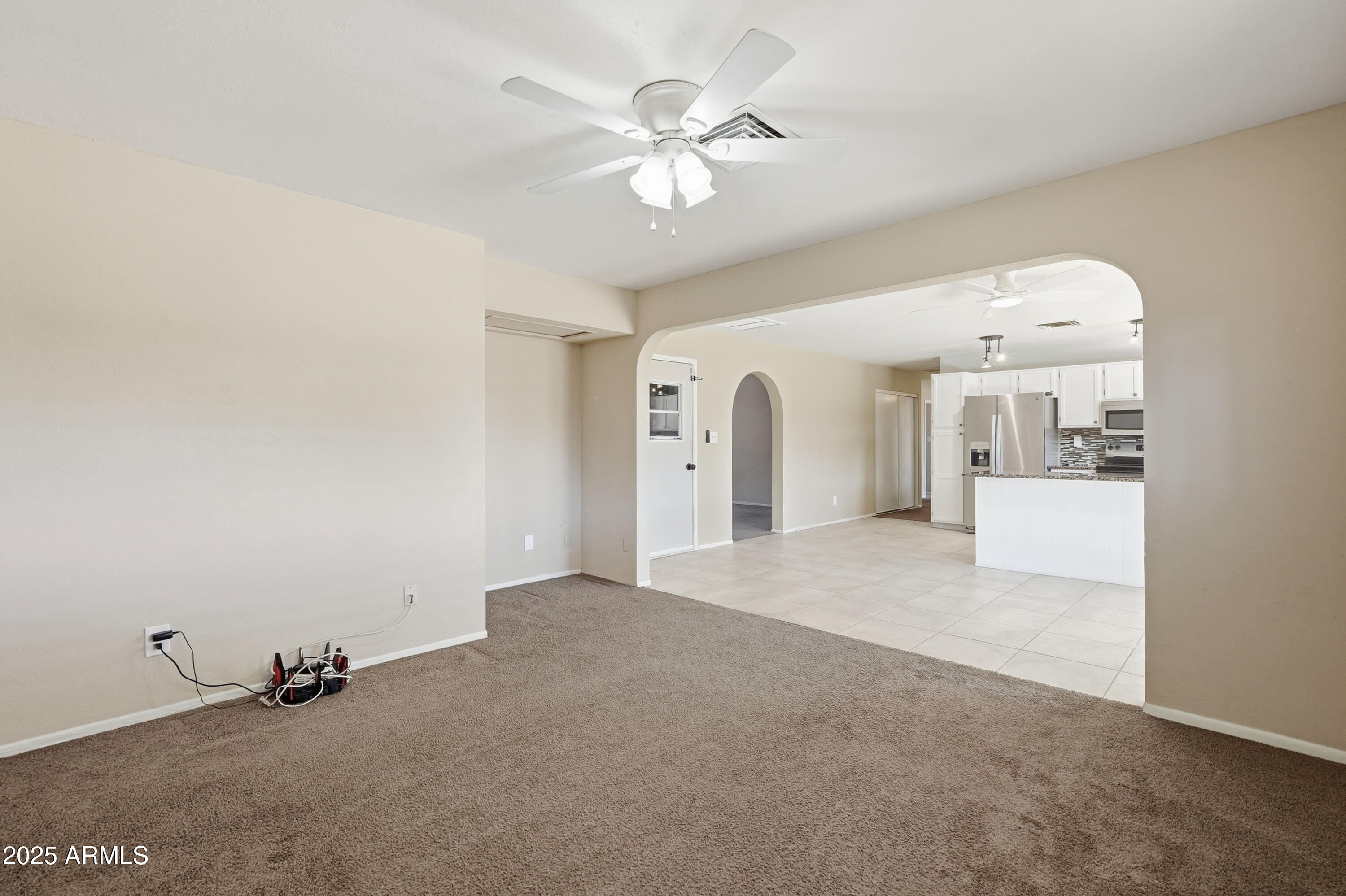 953 East Hackamore Street Mesa, AZ 85203 - Photo 7 of 44 a view of a livingroom with a ceiling fan