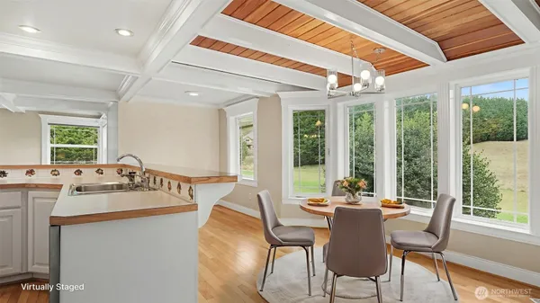 a view of a dining room with furniture window and outside view