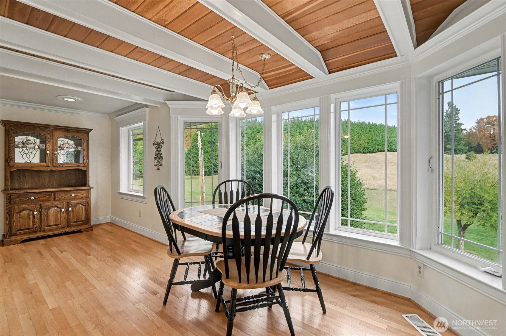 18530 Southeast 145th Street Renton, WA 98059 - Photo 12 of 40 a view of a dining room with furniture window and wooden floor