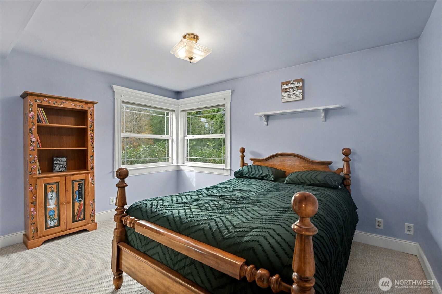 18530 Southeast 145th Street Renton, WA 98059 - Photo 18 of 40 a bed sitting in a bedroom next to a window