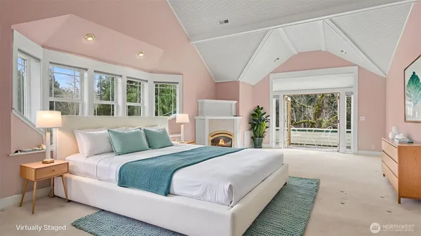 a spacious bedroom with a large bed and a large window