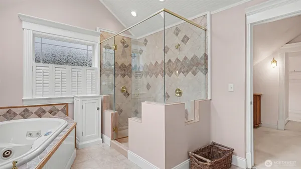 a bathroom with a bathtub and a shower