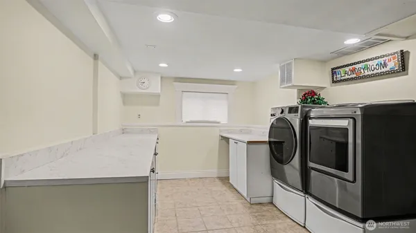 a kitchen with refrigerator and cabinets