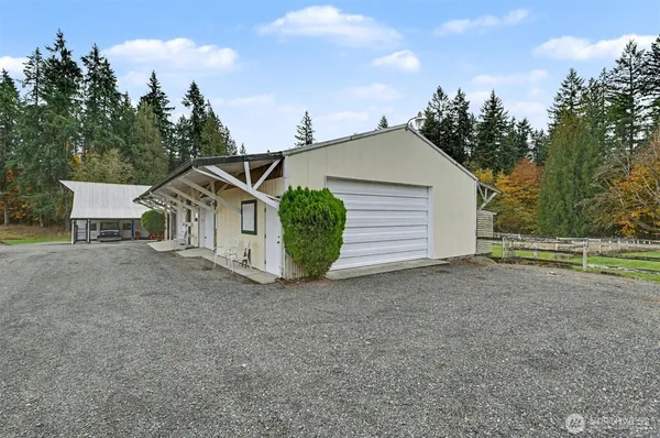 a view of a house with a yard and garage
