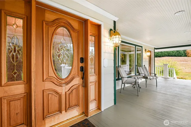 a view of a livingroom with furniture window and wooden floor