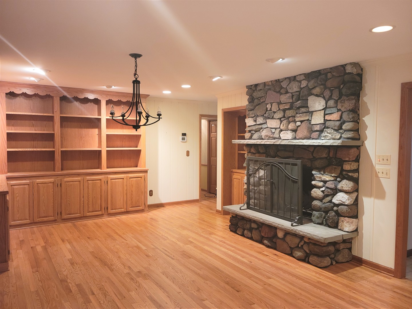 18715 Hebron Road Harvard, IL 60033 - Photo 14 of 54 a view of a room with wooden floor and a fireplace