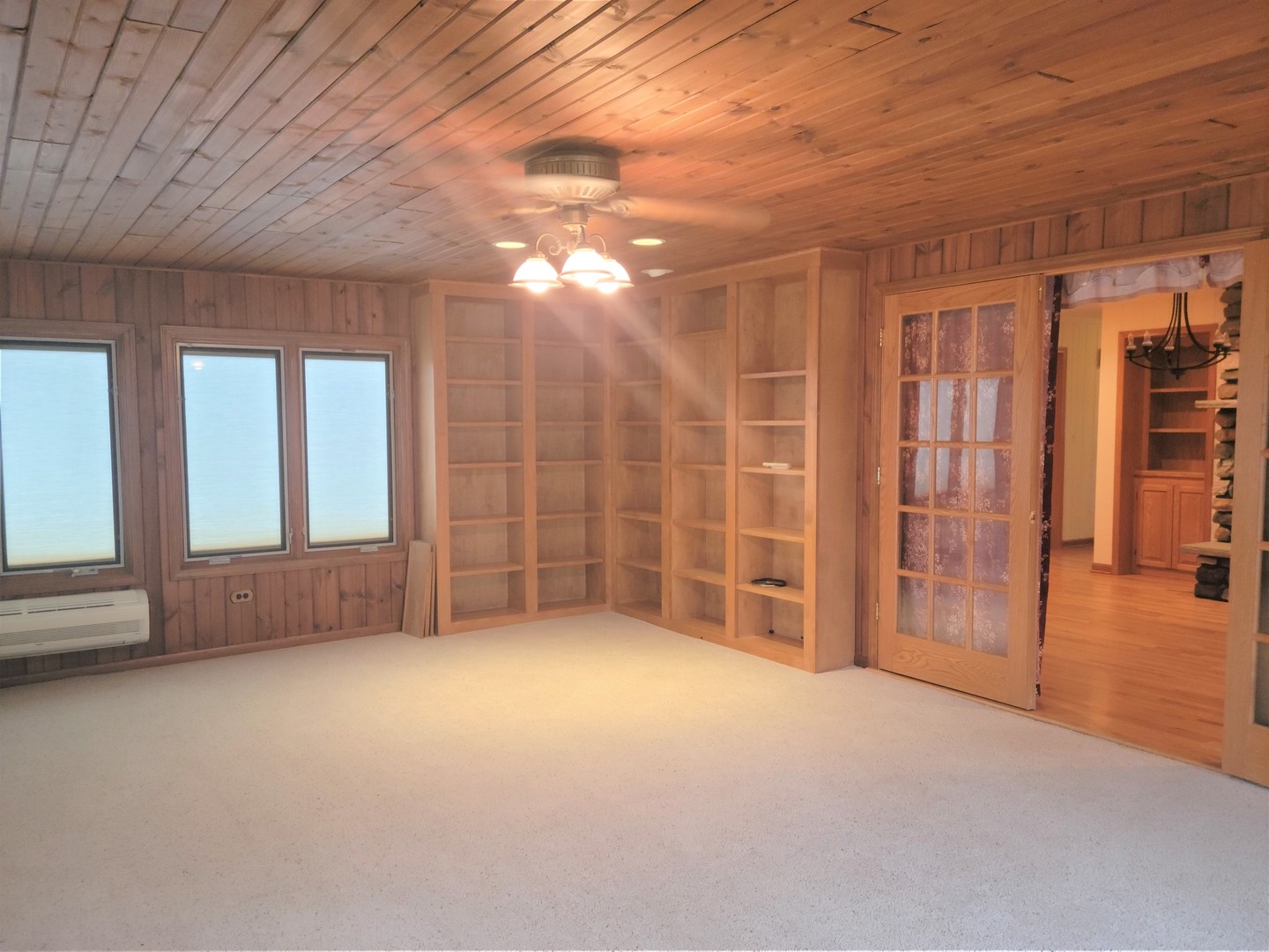 18715 Hebron Road Harvard, IL 60033 - Photo 17 of 54 a view of an empty room with glass door and door