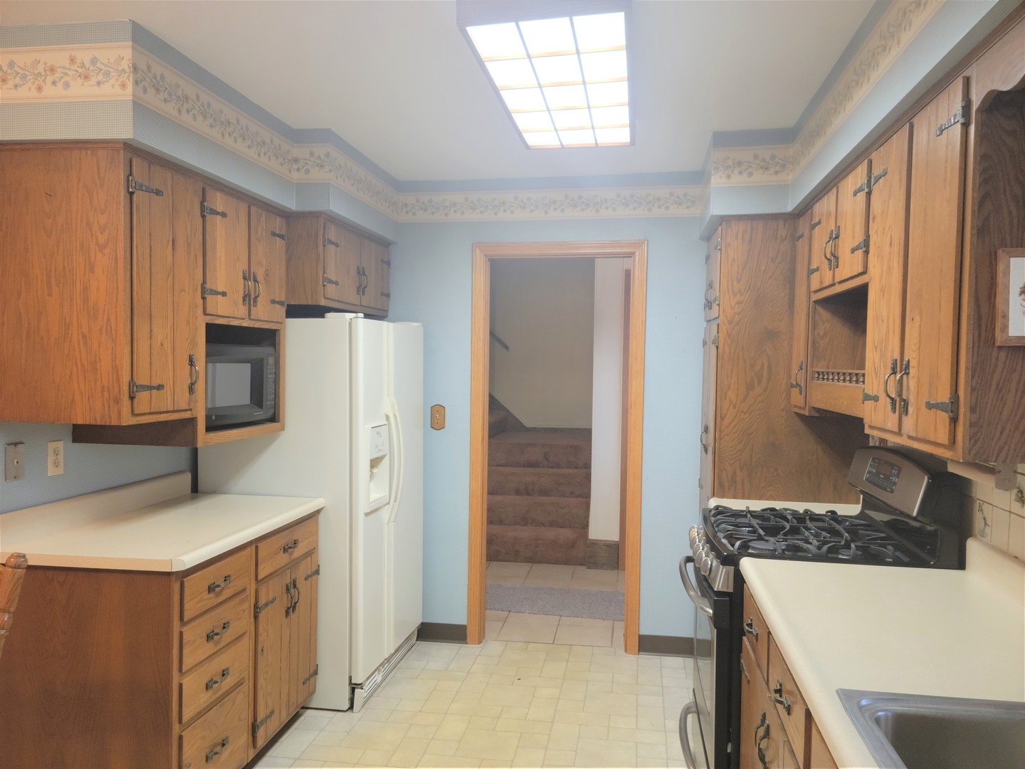 18715 Hebron Road Harvard, IL 60033 - Photo 19 of 54 a kitchen with stainless steel appliances granite countertop a refrigerator and a stove