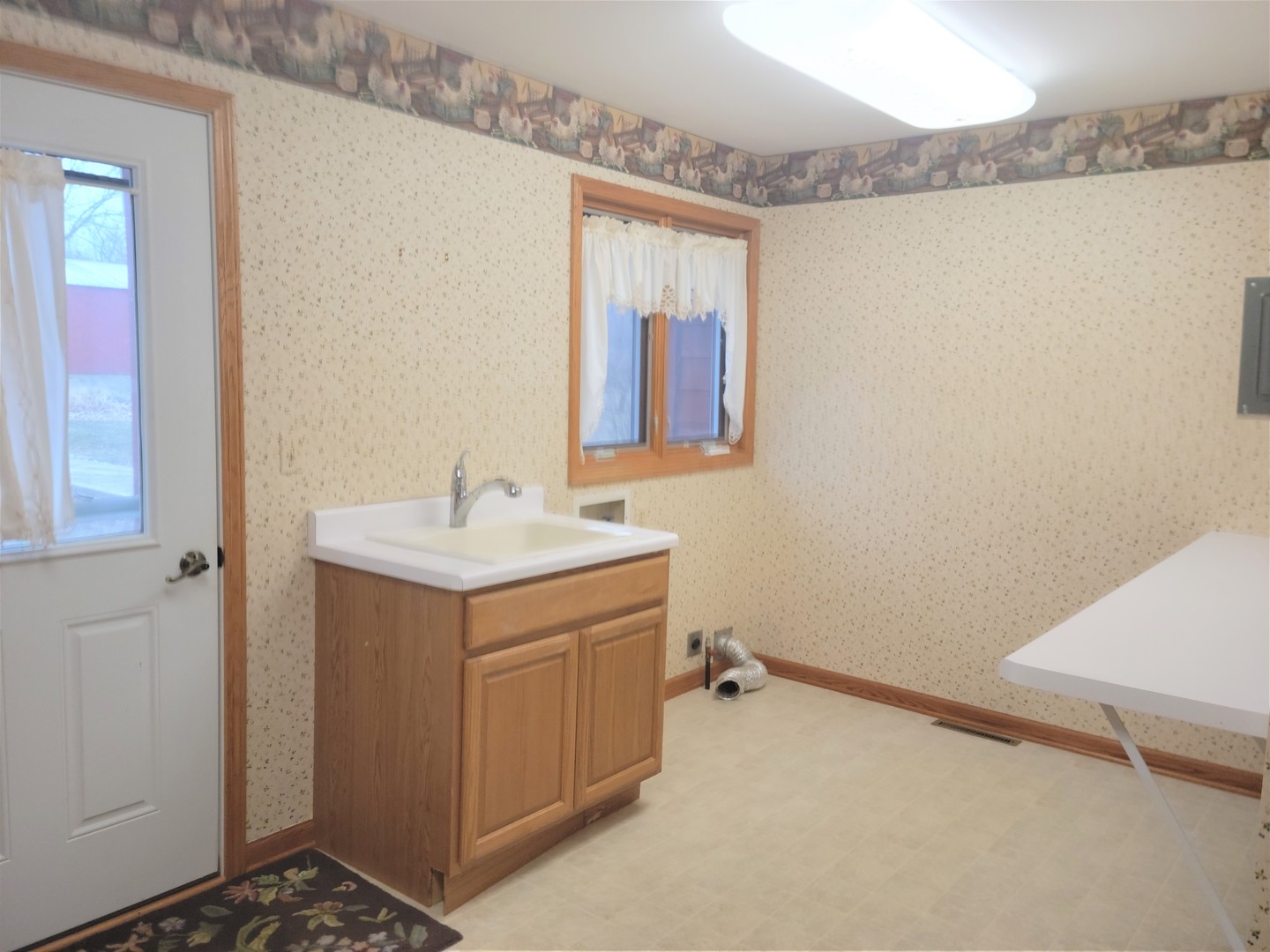 18715 Hebron Road Harvard, IL 60033 - Photo 24 of 54 a bathroom with a sink and a mirror