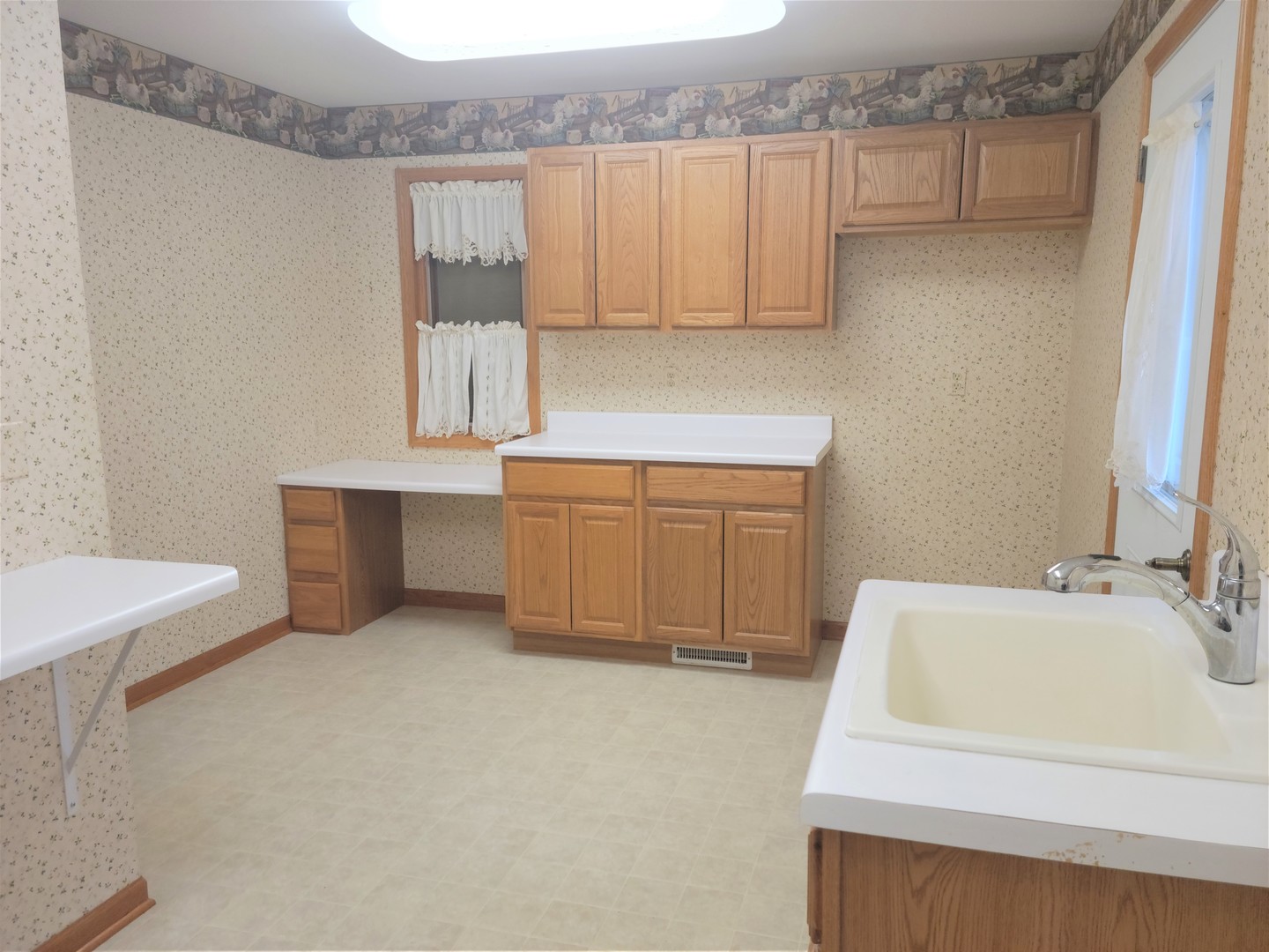 18715 Hebron Road Harvard, IL 60033 - Photo 25 of 54 a bathroom with a sink a vanity and mirror